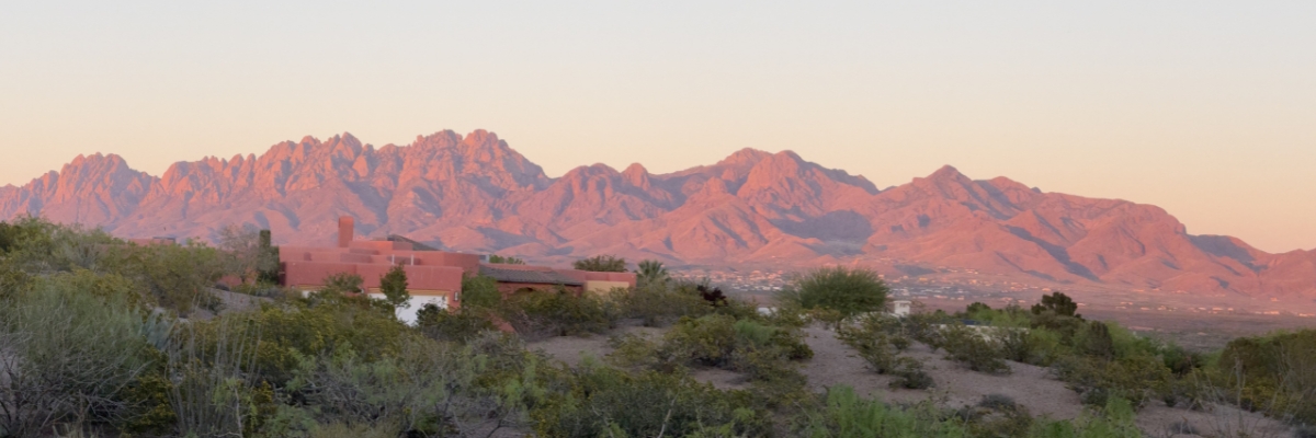 Image of red mountains in a dessert setting.