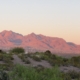 Image of red mountains in a dessert setting.